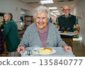 Group of seniors having lunch in community center cafeteria. 135840777