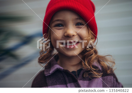 Cute toddler girl smiling outdoors. Cute toddler girl smiling outdoors. 135840822
