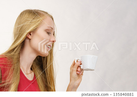Blonde girl with coffee cup 135840881