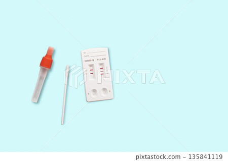 Rapid Antigen Test kit with positive result during swab COVID-19 testing. Home Isolation concept Rapid Antigen Test kit with positive result during swab COVID-19 testing. Home Isolation concept 135841119