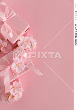 Pink Gift Boxes and Chery Blossom. Romantic Valentines or Mothers Day Flatlay on Soft Pink Background Pink Gift Boxes and Chery Blossom. Romantic Valentines or Mothers Day Flatlay on Soft Pink Background 135841133