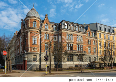 Historic building at 33 Elizabetes Street, Riga, Latvia. Eclectic architecture in the Embassy District. Red brick facade and corner tower, built in 1901. Historic building at 33 Elizabetes Street, Riga, Latvia. Eclectic architecture in the Embassy District. Red brick facade and corner tower, built in 1901. 135841383