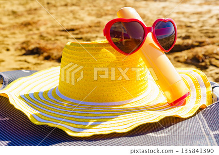 Sun protection acessories on beach 135841390