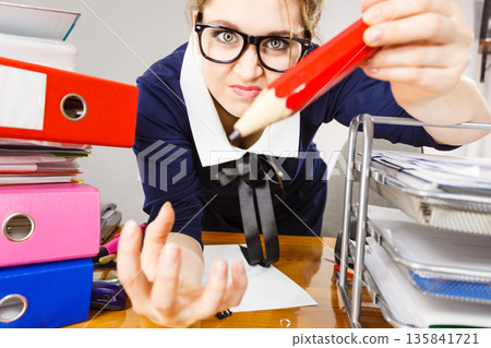 Angry mad business woman being furious Angry mad business woman being furious 135841721