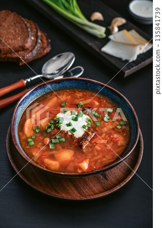 Bowl of red beetroot soup borscht with white cream Bowl of red beetroot soup borscht with white cream 135841739