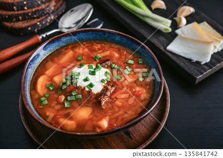 Bowl of red beetroot soup borscht with white cream Bowl of red beetroot soup borscht with white cream 135841742