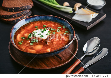 Bowl of red beetroot soup borscht with white cream Bowl of red beetroot soup borscht with white cream 135841771