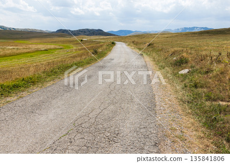 Landscape photography of Durmitor, Montenegro. A cracked asphalt road Landscape photography of Durmitor, Montenegro. A cracked asphalt road 135841806