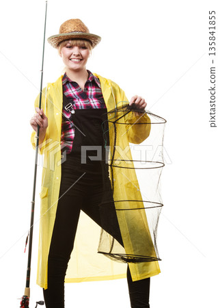 Happy woman holding fishing rod and keepnet 135841855