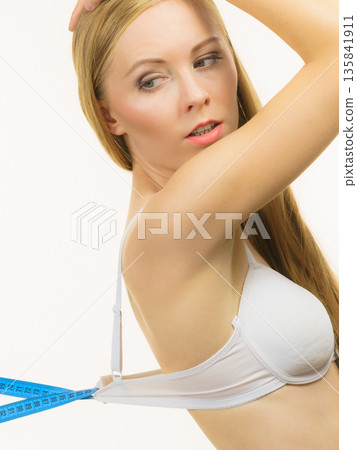 Woman wearing too big bra, loose band Woman wearing too big bra, loose band 135841911