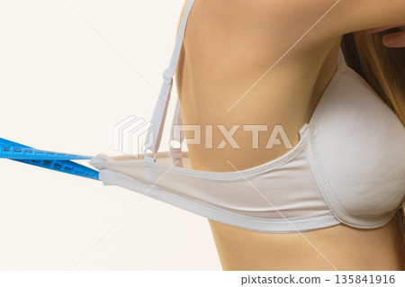 Woman wearing too big bra, loose band Woman wearing too big bra, loose band 135841916