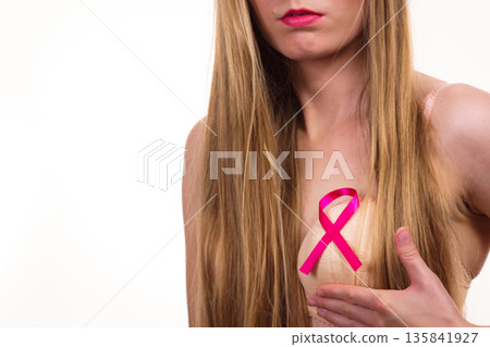 Woman chest in bra, pink cancer ribbon 135841927