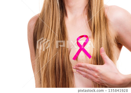 Woman chest in bra, pink cancer ribbon 135841928