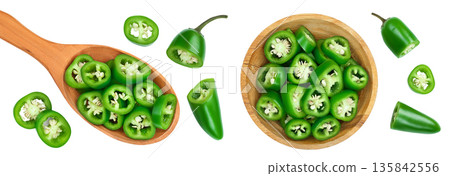 sliced jalapeno pepper in wooden bowl isolated on white background. Green chili pepper . Top view. Flat lay sliced jalapeno pepper in wooden bowl isolated on white background. Green chili pepper . Top view. Flat lay 135842556