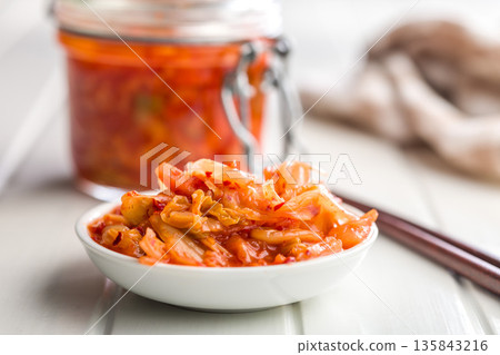 Fermented cabbage. Kimchi. Korean food in bowl on white table. Fermented cabbage. Kimchi. Korean food in bowl on white table. 135843216