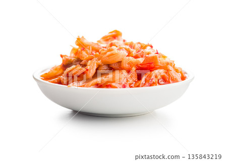 Fermented cabbage. Kimchi. Korean food in bowl isolated on white background. Fermented cabbage. Kimchi. Korean food in bowl isolated on white background. 135843219