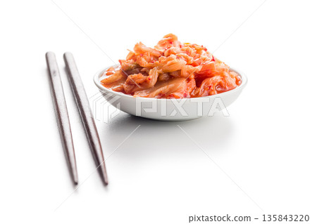 Fermented cabbage. Kimchi. Korean food in bowl isolated on white background. 135843220
