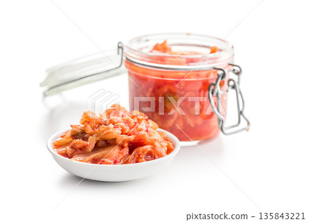 Fermented cabbage. Kimchi. Korean food in bowl isolated on white background. Fermented cabbage. Kimchi. Korean food in bowl isolated on white background. 135843221