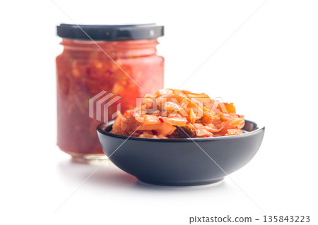 Fermented cabbage. Kimchi. Korean food in bowl isolated on white background. Fermented cabbage. Kimchi. Korean food in bowl isolated on white background. 135843223