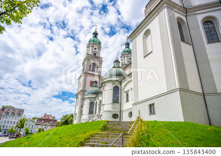 Baroque St. Lorenz Basilica, located in Kempten, Bavaria, features impressive twin towers and a striking facade. 135843400