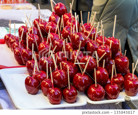 Red caramel apples on stick Red caramel apples on stick 135843817