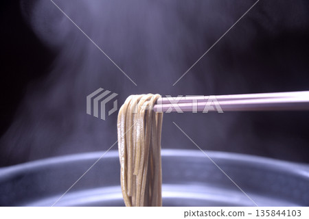 Boiling soba noodles in a steaming pot 135844103
