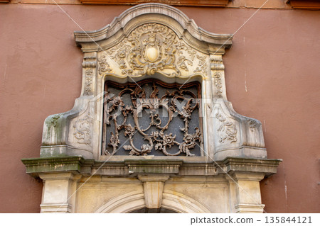 Ornate baroque window detail on historic townhouse facade Ornate baroque window detail on historic townhouse facade 135844121