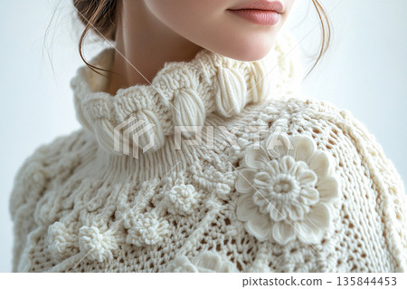 Craft influencer vibe. Crochet details on a modern garment in a white background. Craft influencer vibe. Crochet details on a modern garment in a white background. 135844453