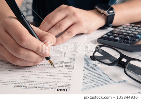 Tax return concept wits US 1040 tax form 135844930