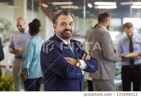 Confident mature businessman looking at camera, portrait Confident mature businessman looking at camera, portrait 135846012