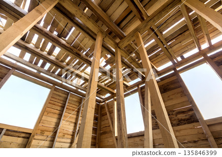 New wooden house under construction. Close-up of walls and roof 135846399