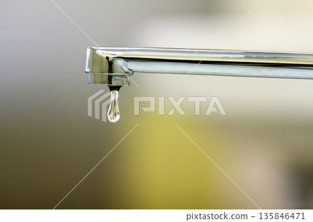 Close-up of faucet with turned drop water in modern bathroom. Horizontal crop with shallow depth of field Close-up of faucet with turned drop water in modern bathroom. Horizontal crop with shallow depth of field 135846471