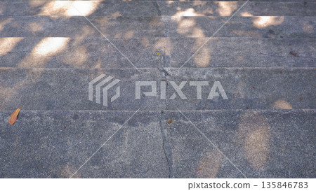 High Angle View of Cracked Concrete Stairs with Sunlight High Angle View of Cracked Concrete Stairs with Sunlight 135846783