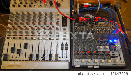 Professional Audio Mixing Consoles with Many Knobs and Sliders 135847309