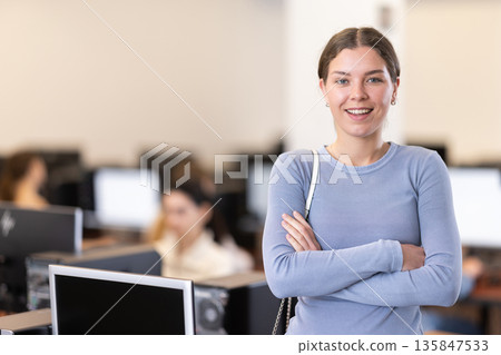Young woman while working in office Young woman while working in office 135847533