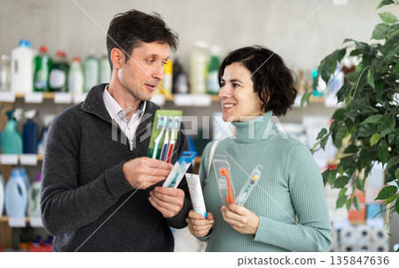 Husband and wife buy toothbrushes 135847636