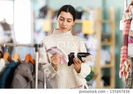 Regular customer Armenian woman chooses color and style of socks 135847836