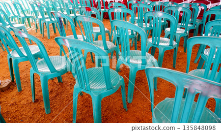 Teal Plastic Chairs Pattern on Brown Ground for Outdoor Occasion Teal Plastic Chairs Pattern on Brown Ground for Outdoor Occasion 135848098