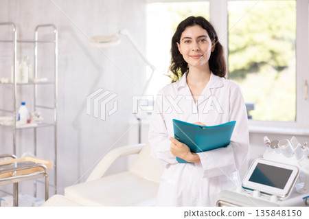 doctor meticulously stands in her clinic 135848150