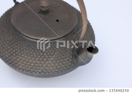 An old Nambu iron kettle that has been left unused for a long time and is starting to rust. An old Nambu iron kettle that has been left unused for a long time and is starting to rust. 135848250
