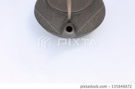 An old Nambu iron kettle that has been left unused for a long time and is starting to rust. An old Nambu iron kettle that has been left unused for a long time and is starting to rust. 135848872