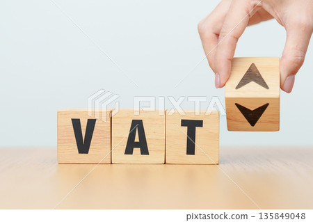 hand change wooden block with VAT text to UP and Down arrow icon. Value Added Tax, decrease and Increase, Taxpayer, Taxable Income, Tax Filing, Deduction, Withholding Tax, Computation and Exemption hand change wooden block with VAT text to UP and Down arrow icon. Value Added Tax, decrease and Increase, Taxpayer, Taxable Income, Tax Filing, Deduction, Withholding Tax, Computation and Exemption 135849048