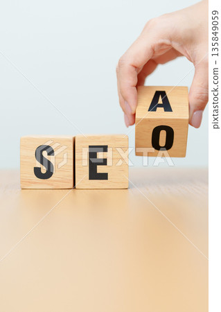 Hand change Wooden block from SEA to SEO. Search Engine Optimization, SEM, Advertising, Marketing, Idea, Strategy, Keyword, Content and technology concept 135849059