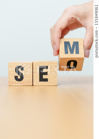 Hand change Wooden block from SEO to SEM. Search Engine Optimization, SEA, Advertising, Marketing, Idea, Strategy, Keyword, Content and technology concept 135849061