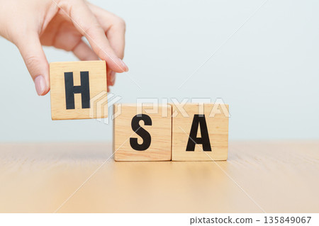 hand change wooden block from FSA. HSA, Flexible Spending Account and Health Savings Account, Medical Expenses, Tax Benefits and healthcare concepts 135849067