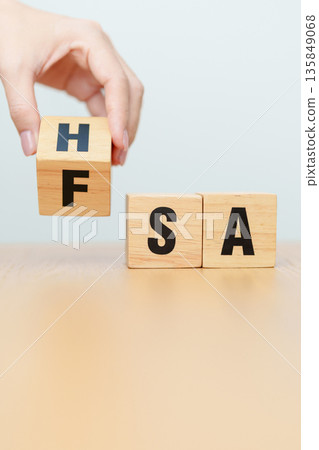 hand change wooden block from FSA to HSA. Flexible Spending Account and Health Savings Account, Medical Expenses, Tax Benefits and healthcare concepts 135849068
