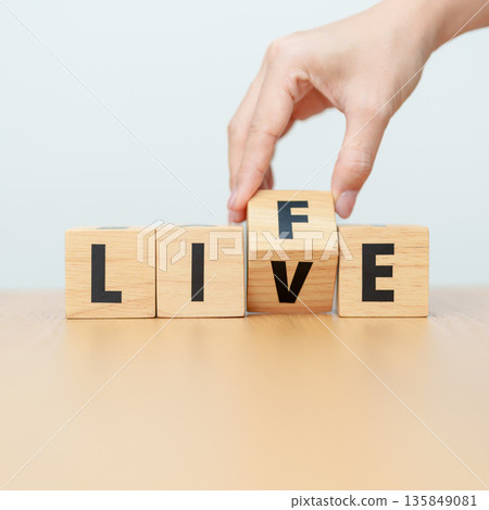 hand change wooden block Live to Life. Lifestyle, Live your life, learning, motivation and mindset concepts 135849081
