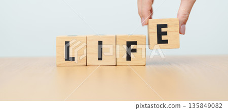hand change wooden block Live to Life. Lifestyle, Live your life, learning, motivation and mindset concepts 135849082