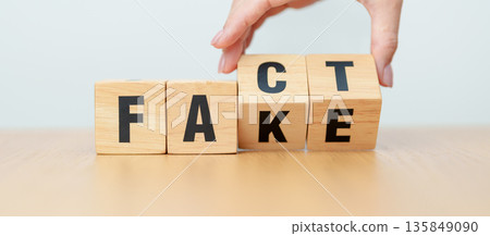 hand change wooden block FAKE to FACT. rumor News, false, myth, evidence and disinformation concepts hand change wooden block FAKE to FACT. rumor News, false, myth, evidence and disinformation concepts 135849090