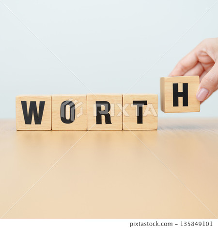 hand change wooden block Work to Worth. Know your worth concept 135849101